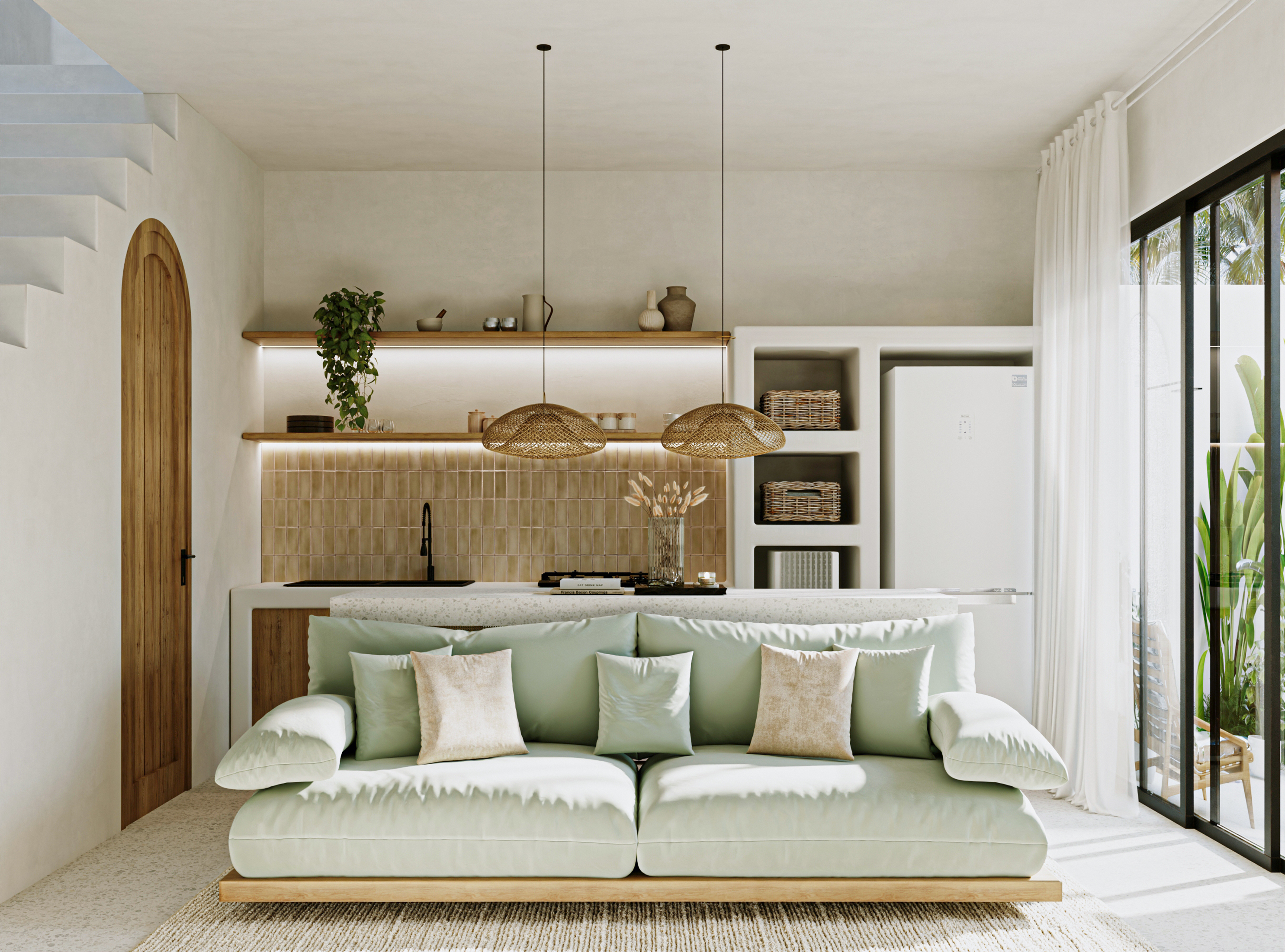 Open living room with sage sofa and tiled kitchen
