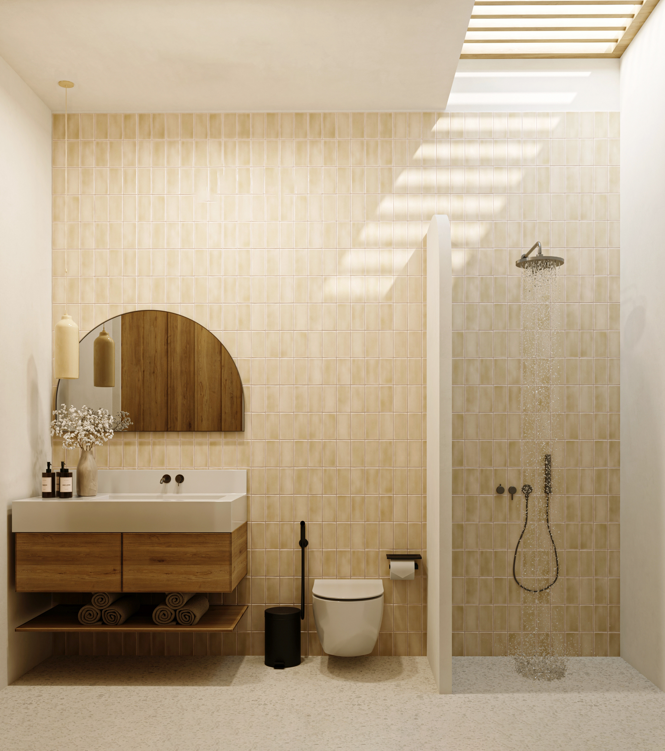 Bathroom with soft yellow tile and arched mirror